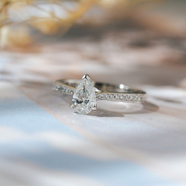 V-Tip Pear Engagement Ring With Tapered Pavé Band-side