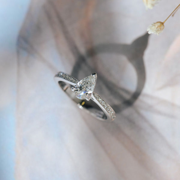 V-Tip Pear Engagement Ring With Tapered Pavé Band-top