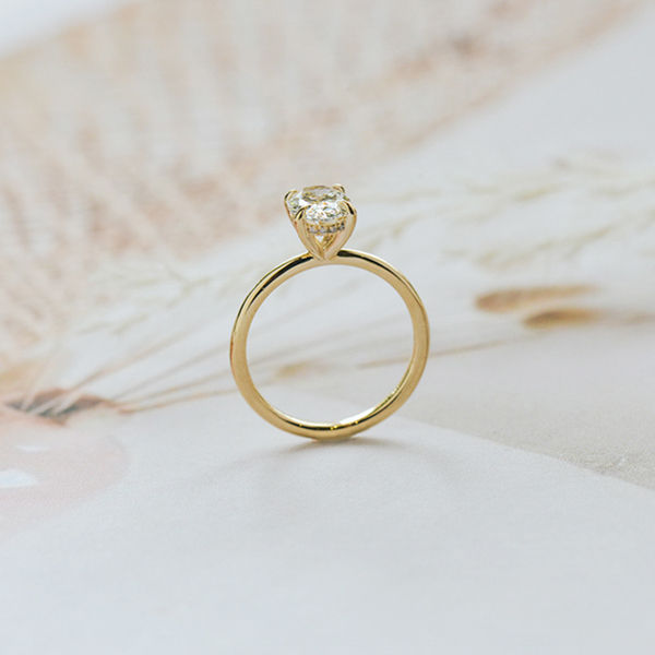 Oval Solitaire Engagement Ring With Hidden Halo And Tapered Band-profile
