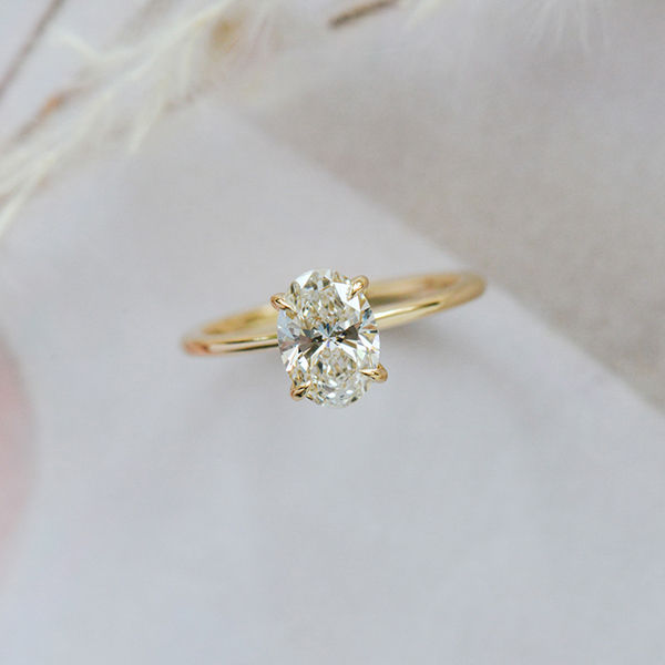 Oval Solitaire Engagement Ring With Hidden Halo And Tapered Band-top