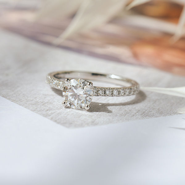 Round Engagement Ring With Hidden Halo Around the Prongs-top