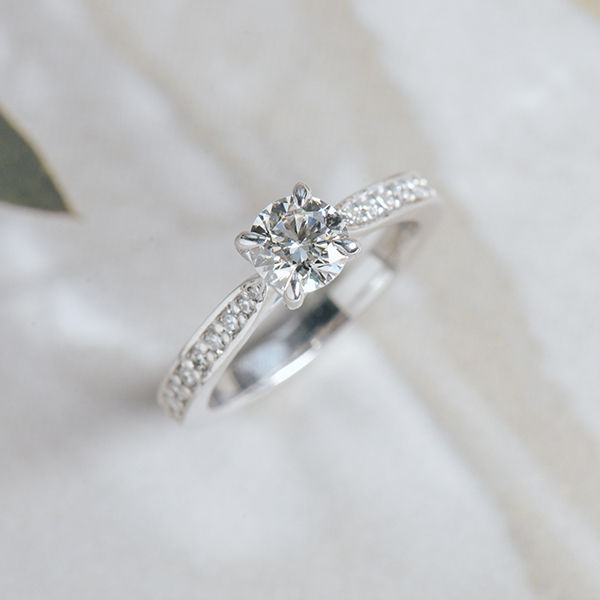 Round Engagement Ring With Channel Set Tapered Band-top