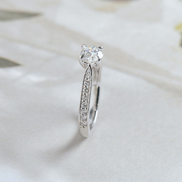 Round Engagement Ring With Channel Set Tapered Band-side