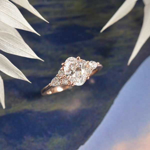 Oval Engagement Ring With Round and Pear Side Stones-top