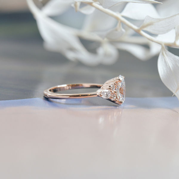 Oval Engagement Ring With Round and Pear Side Stones-profile