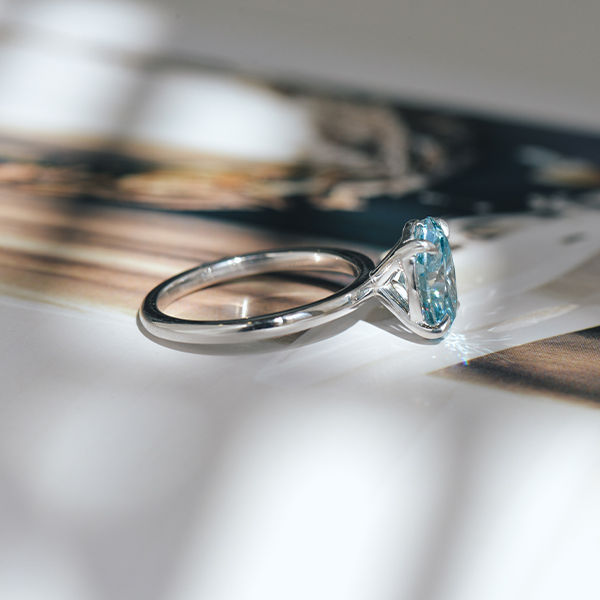 Blue Diamond Oval Solitaire Engagement Ring-side
