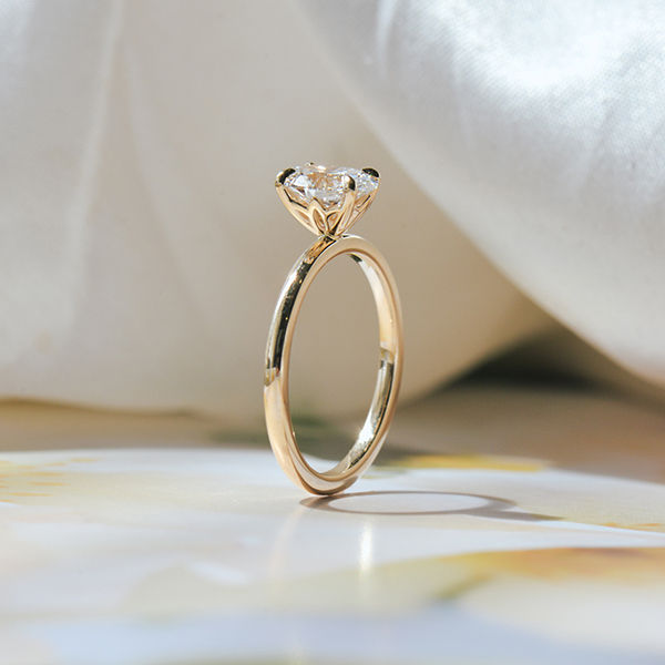 Oval Solitaire Engagement Ring With Sunflower Petal Prongs-profile