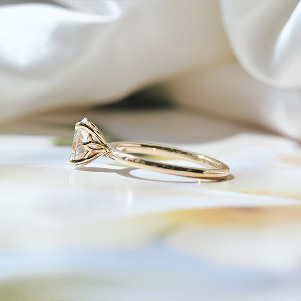 Oval Solitaire Engagement Ring With Sunflower Petal Prongs-side