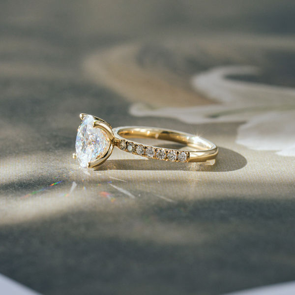 Oval Engagement Ring With Pavé Band and Petal Prong Setting-side