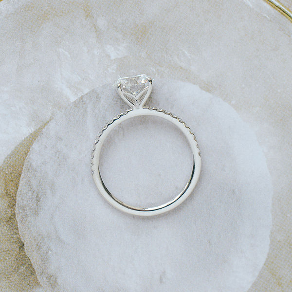 Round Pavé Engagement Ring With Whale Tail -profile