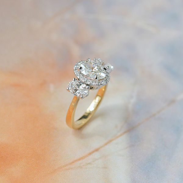Two-Tone 3-Stone Oval Halo Engagement Ring-side