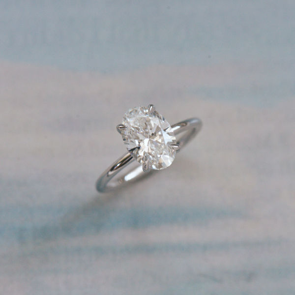 Classic Oval Solitaire Engagement Ring With Hidden Halo-side