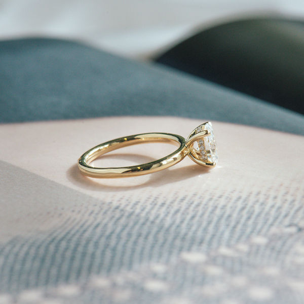 Oval Solitaire Engagement Ring With Hidden Halo And Petite Prongs-side