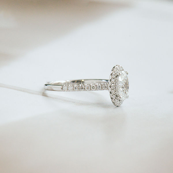 Oval Halo Engagement Ring With Pavé Band -side