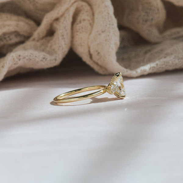 Oval And Round Three Stone Engagement Ring -side