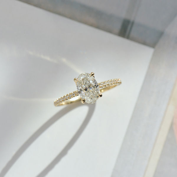 Oval Solitaire Engagement Ring With Pavé-top