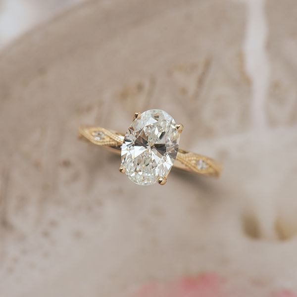 Oval Engagement Ring With Round Stones in Marquise-Shaped Cutout-top