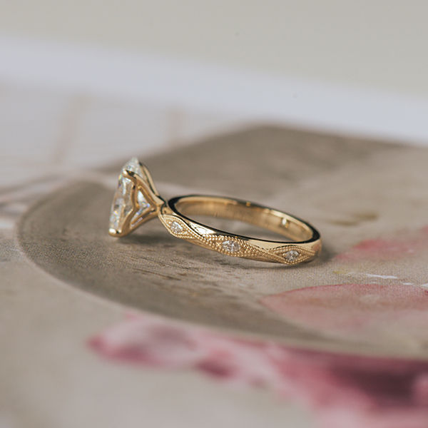 Oval Engagement Ring With Round Stones in Marquise-Shaped Cutout-side