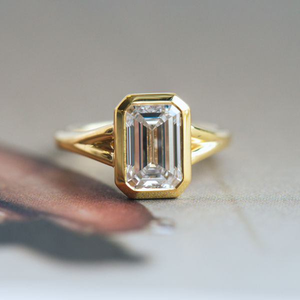 Bezel Set Emerald Engagement Ring With Split-Shank Band-top