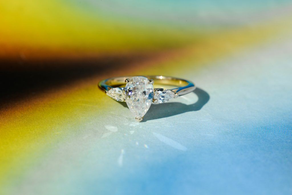 pear moissanite three-stone engagement ring