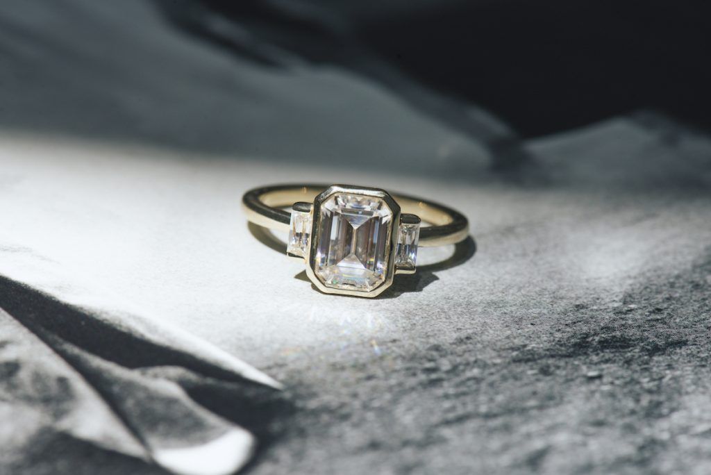 art deco engagement rings - bezel set emerald cut moissanite engagement rings