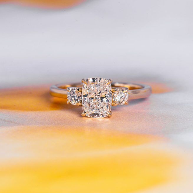 Elongated Cushion + Round Three-Stone Engagement Ring