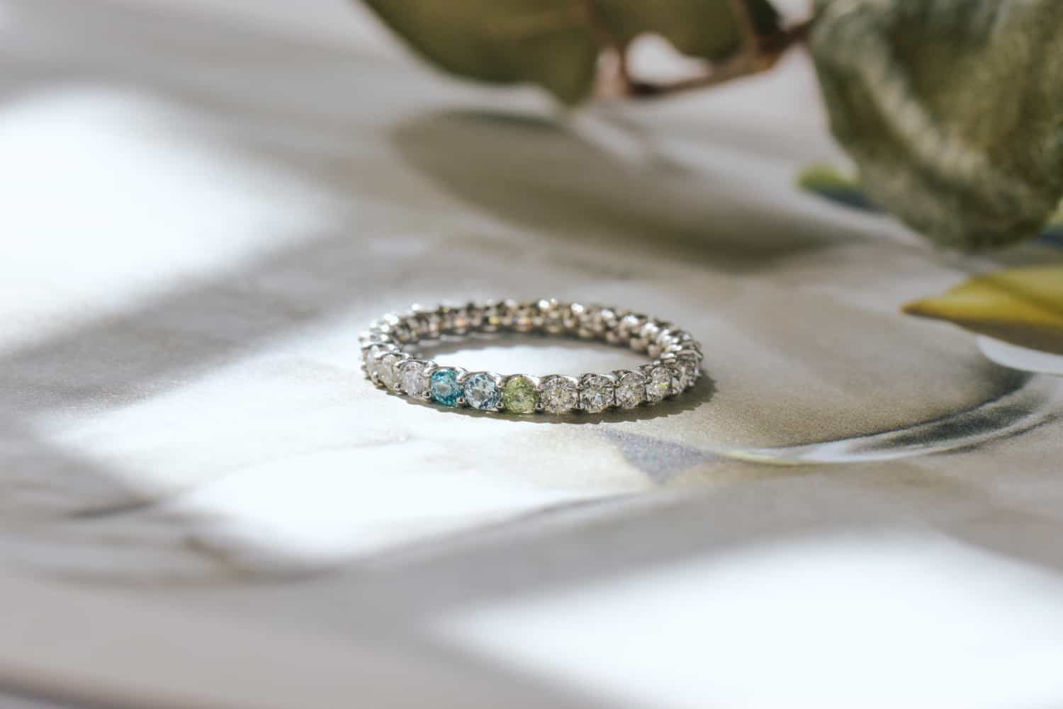 Family reversible ring with aquamarine, peridot, diamond