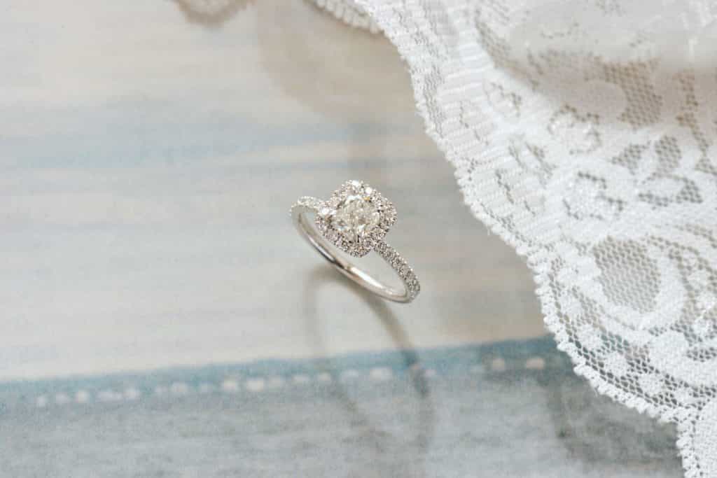 white gold cushion halo engagement ring