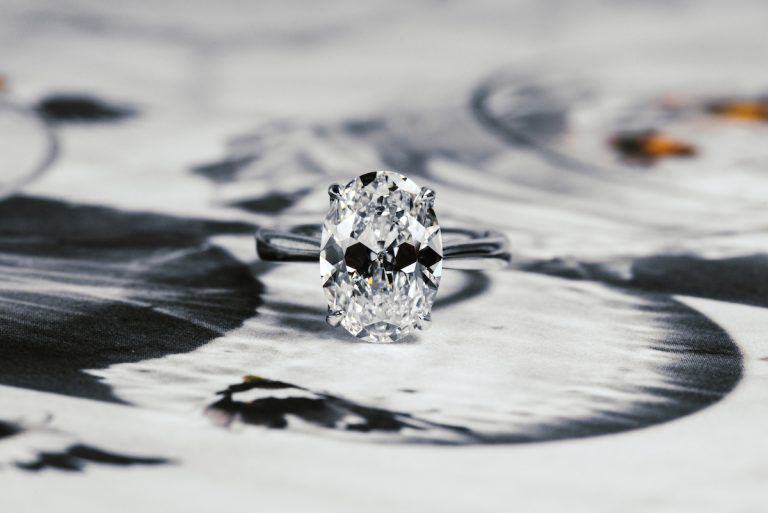 how much do custom engagement rings cost: old mine brilliant cut oval engagement ring, white gold