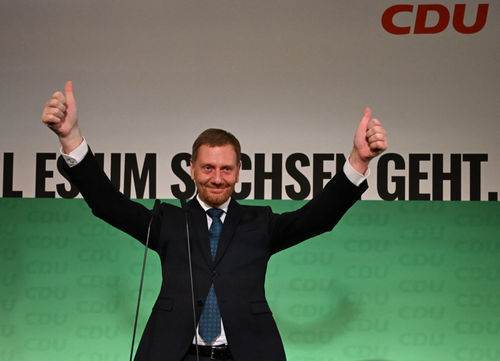 Saxony's State Premier Michael Kretschmer of Germany's conservative Christian Democratic Union (CDU) reacts to the first exit polls results for the Saxony state elections, at the State Parliament in Dresden, eastern Germany on September 1, 2024.