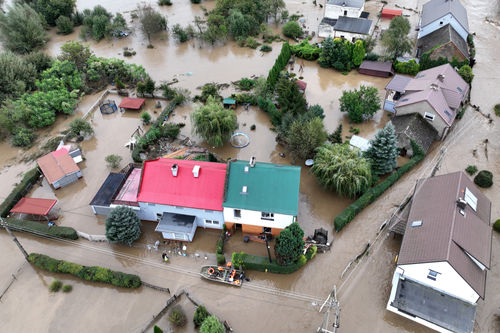 This aerial photograph taken on September 15, 2024 shows local residents being evacuated by Polish rescuers in the village of Rudawa, southern Poland.