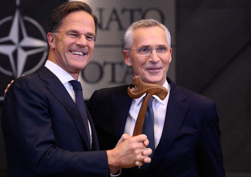 Outgoing NATO Secretary General Jens Stoltenberg (R) and incoming NATO Secretary General and former Dutch Prime Minister Mark Rutte (L) attend a handover ceremony, at NATO Headquarters in Brussels, on October 1, 2024.  (Photo by JOHN THYS / AFP)