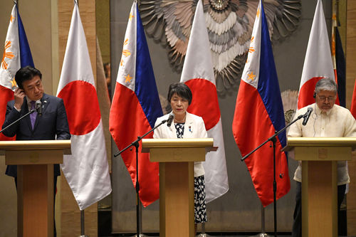 Japan's Foreign Minister Yoko Kamikawa (C) speaks while Japan's Defence Minister Minoru Kihara (L), and Philippines' Secretary of Foreign Affairs Enrique Manalo (R)