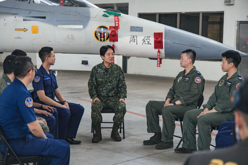 Taiwan's President Lai Ching-te (C) in a military uniform