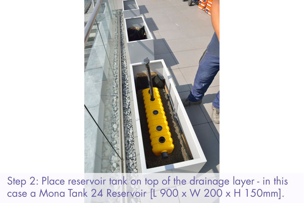Commercial planter instalation: place reservoir tank on top of drainage layer