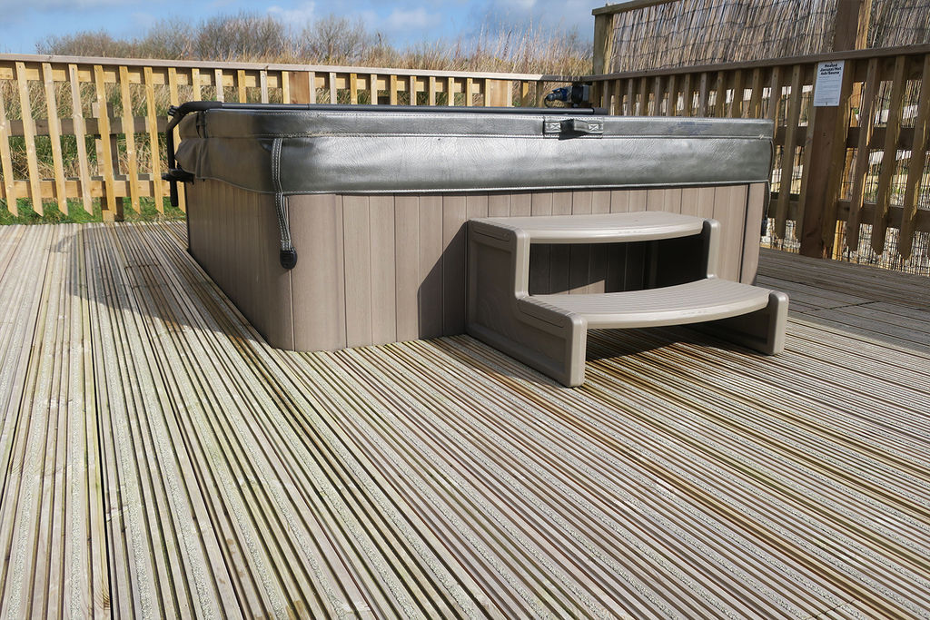Hot Tub Surrounded by Non-Slip Decking at Visitor Lodges