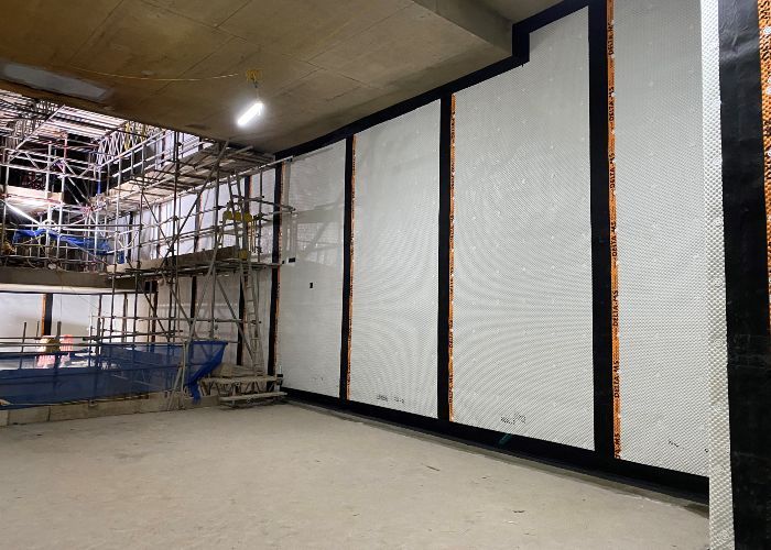 Installation of Delta MS 500 Fire Retardant, Type C waterproofing membrane system in commercial structure