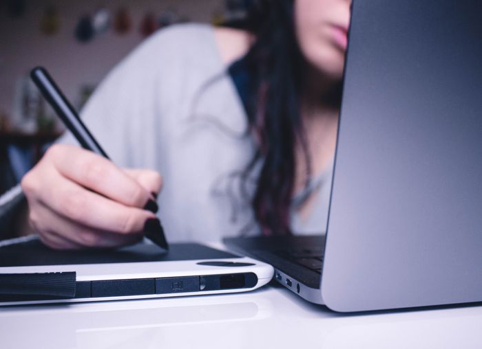 Woman behind a laptop