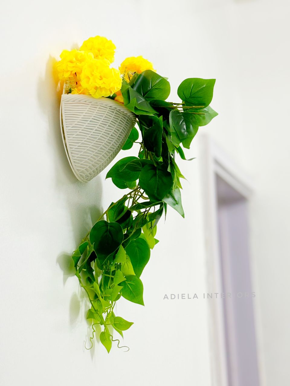 Artificial Flower In Plastic Wall Vase Image