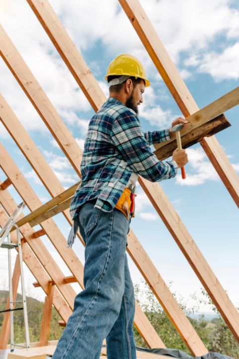 construction-worker-with-hard-hat-building-roof-house