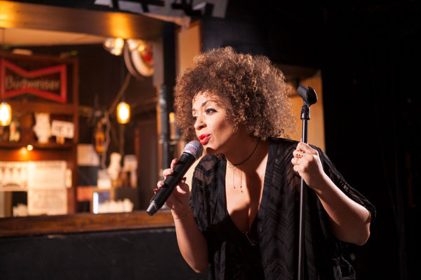 Female singer with wireless microphone