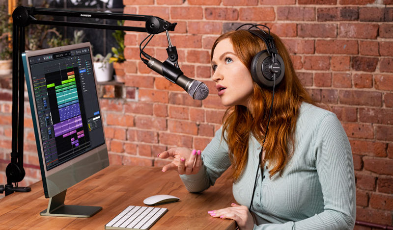 Female podcaster speaking into Q2U Microphone