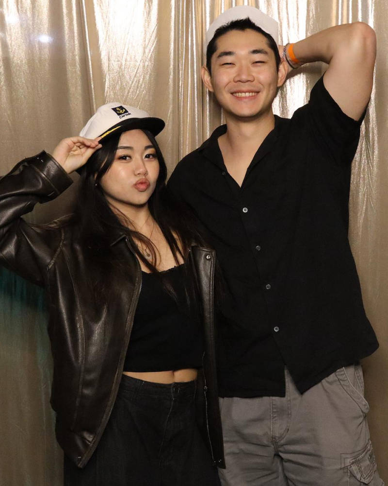 Couple posing for a photo at the Afterlight photo booth
