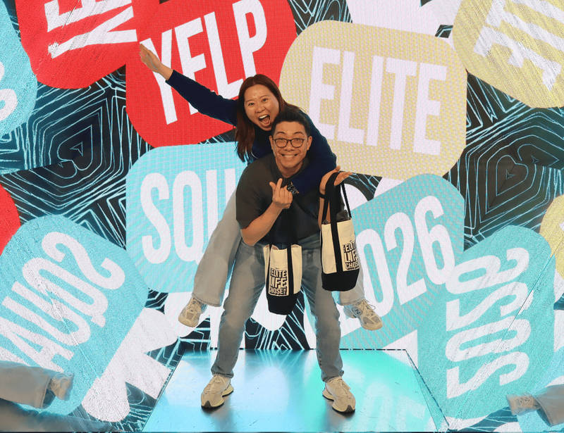 Guests enjoying props at a Brea wedding photo booth