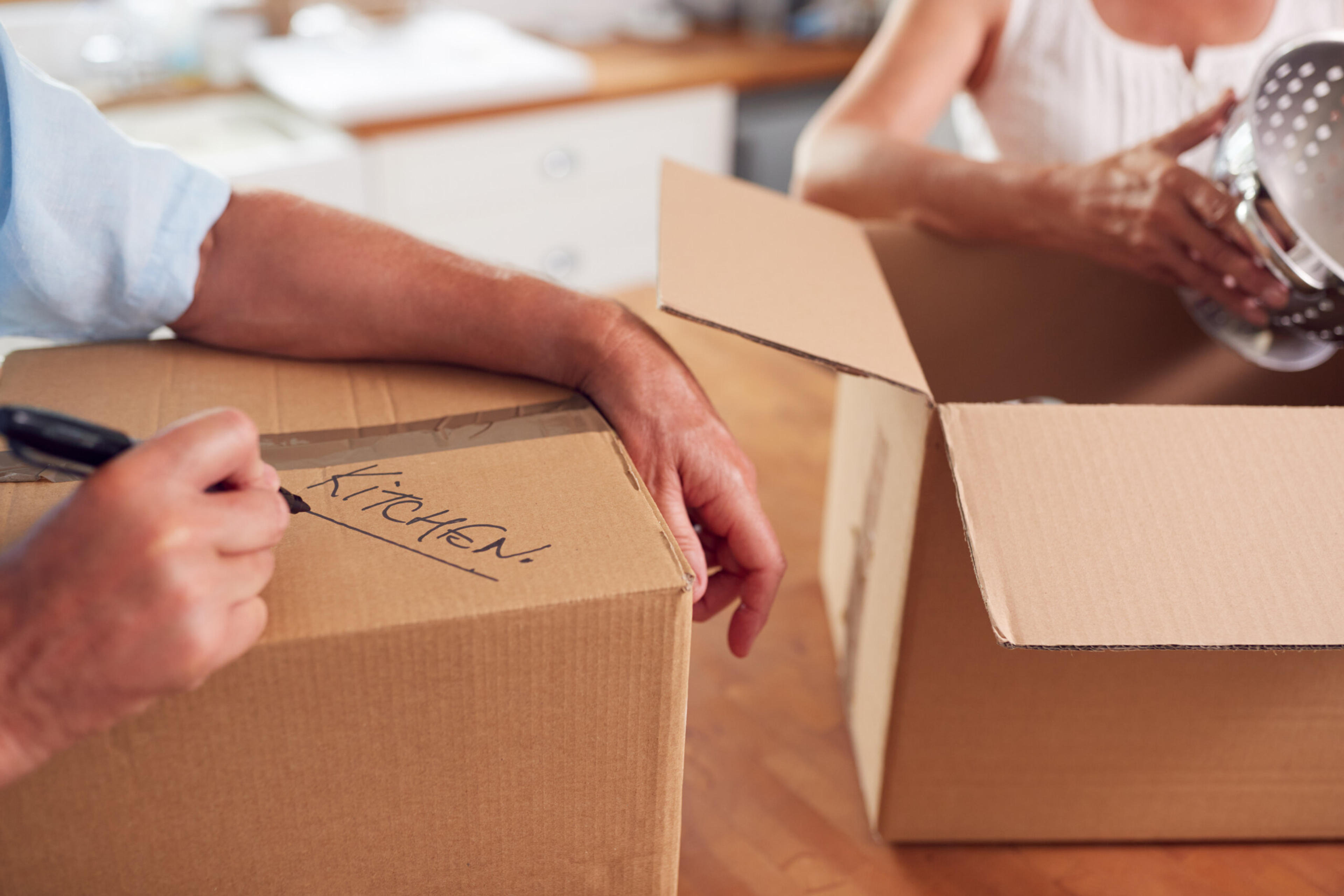 Couple packing up their home as they downsize to a smaller home