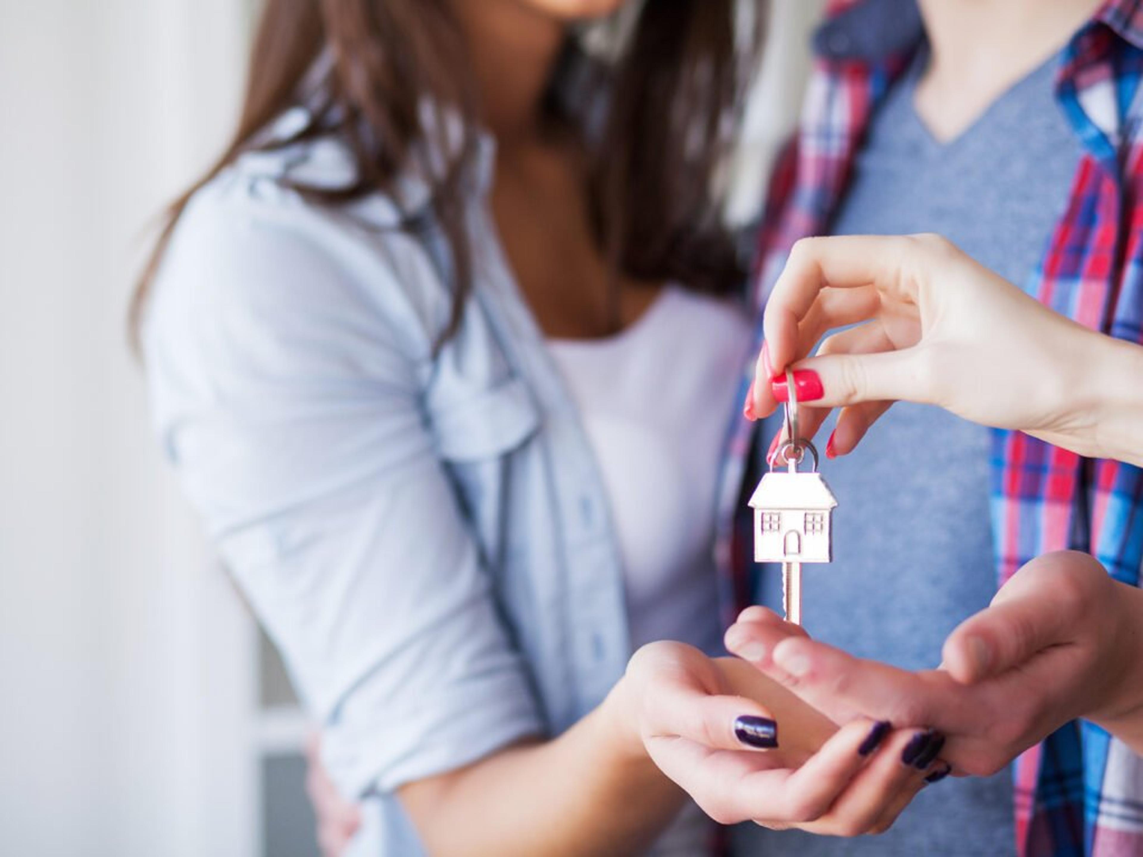 Couple receiving the keys to their new home.