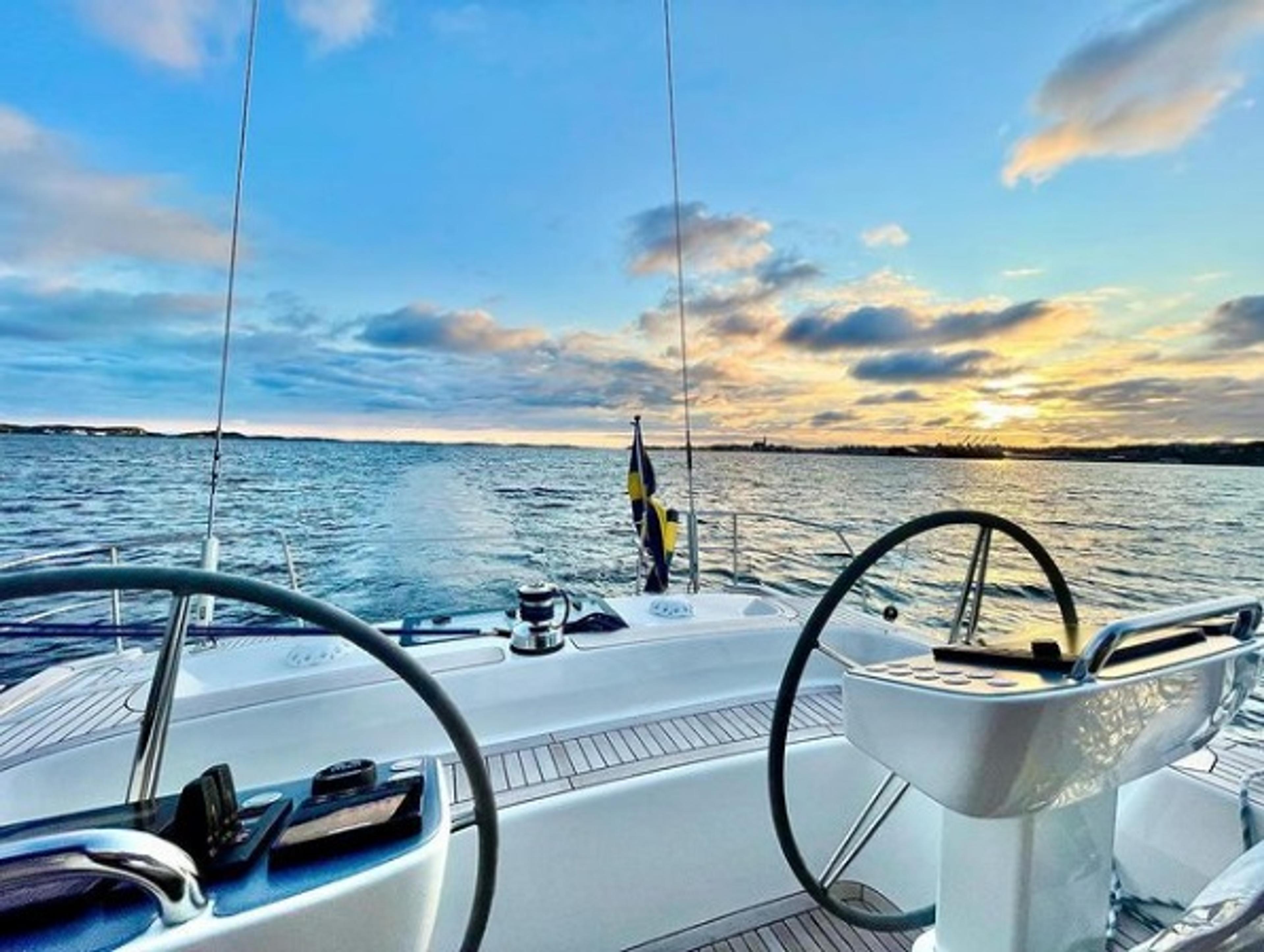 View of the horizon from the front of a yacht