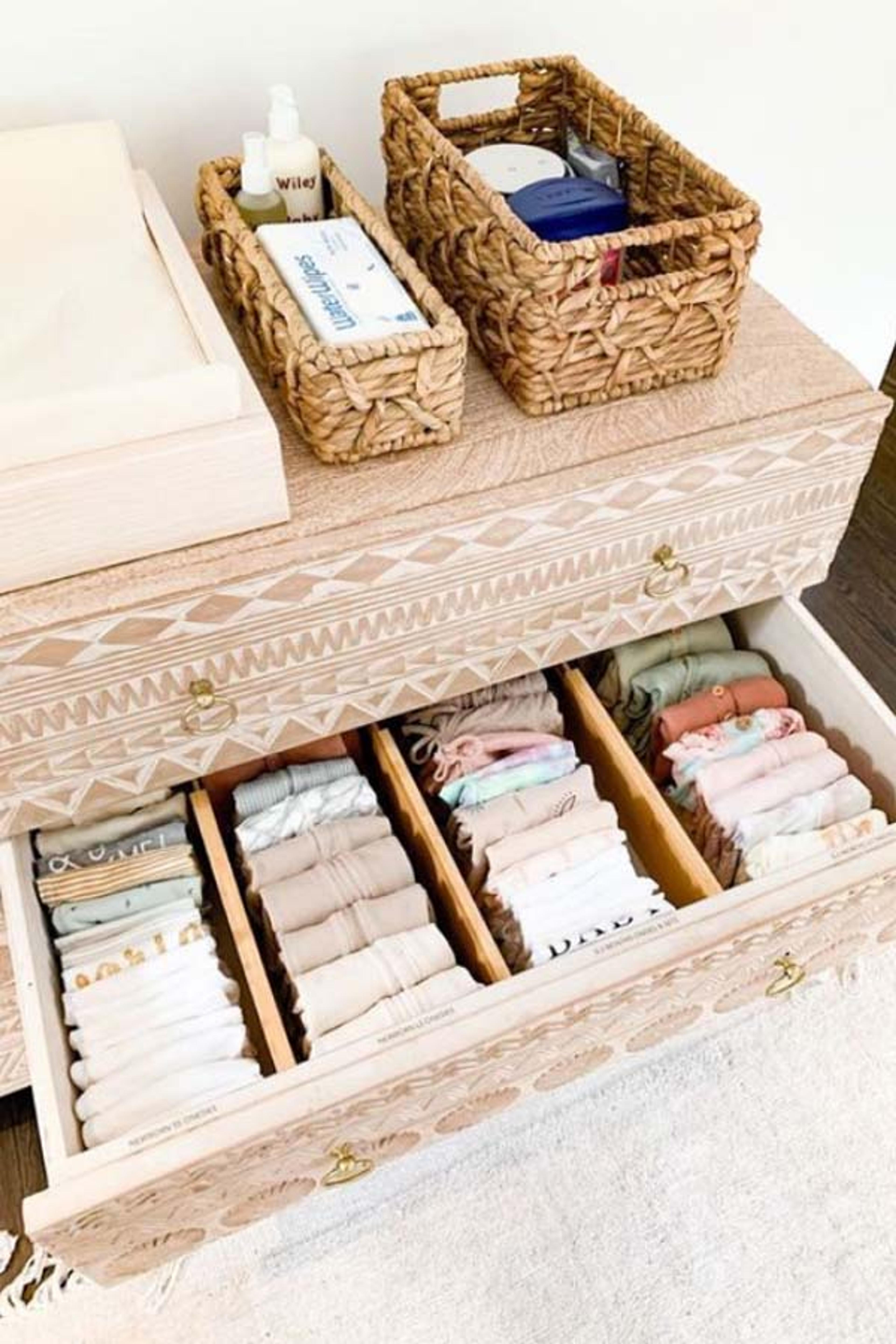 Organized dresser drawers in nursery