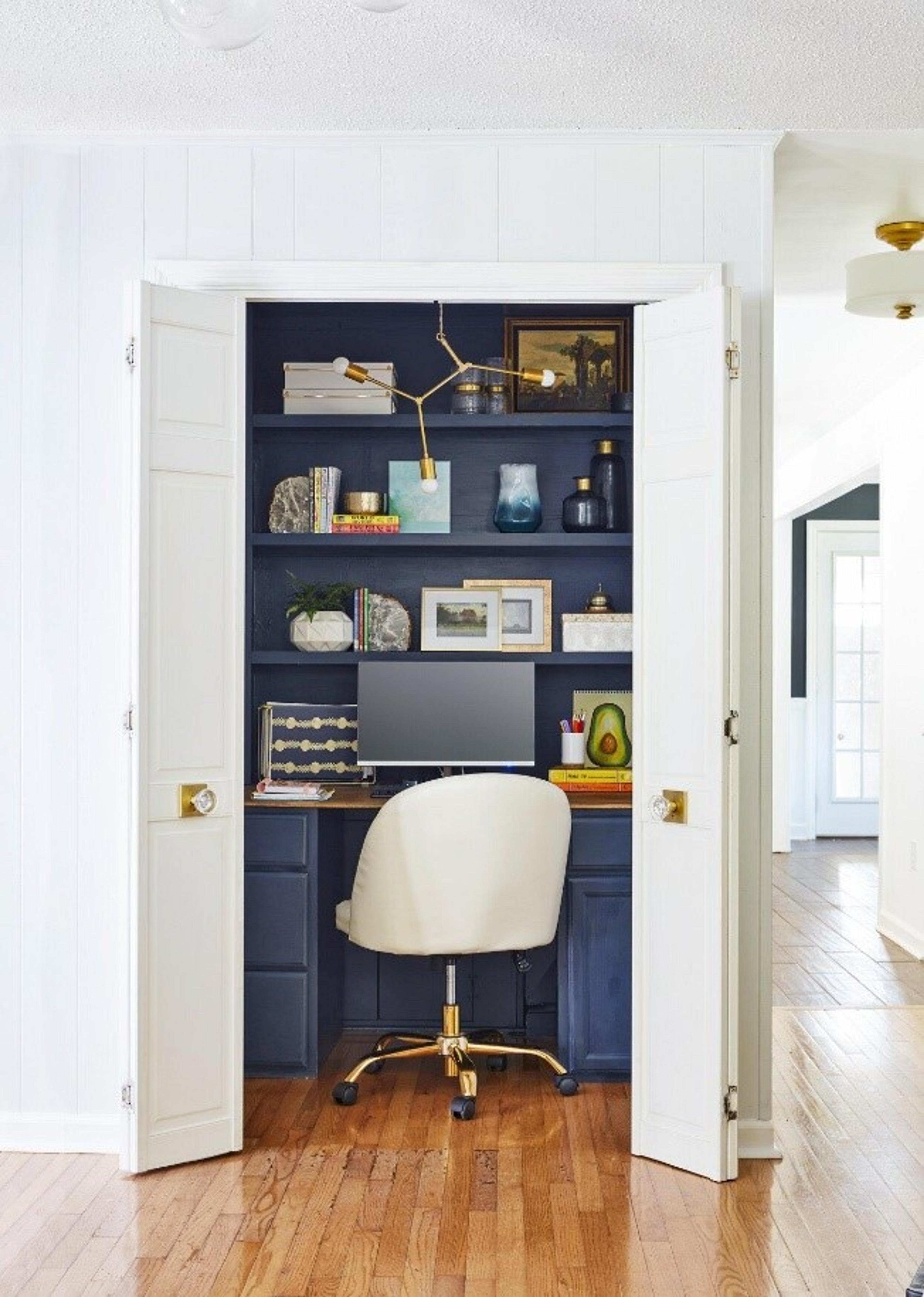 Built-in desk and shelving behind closet doors.
