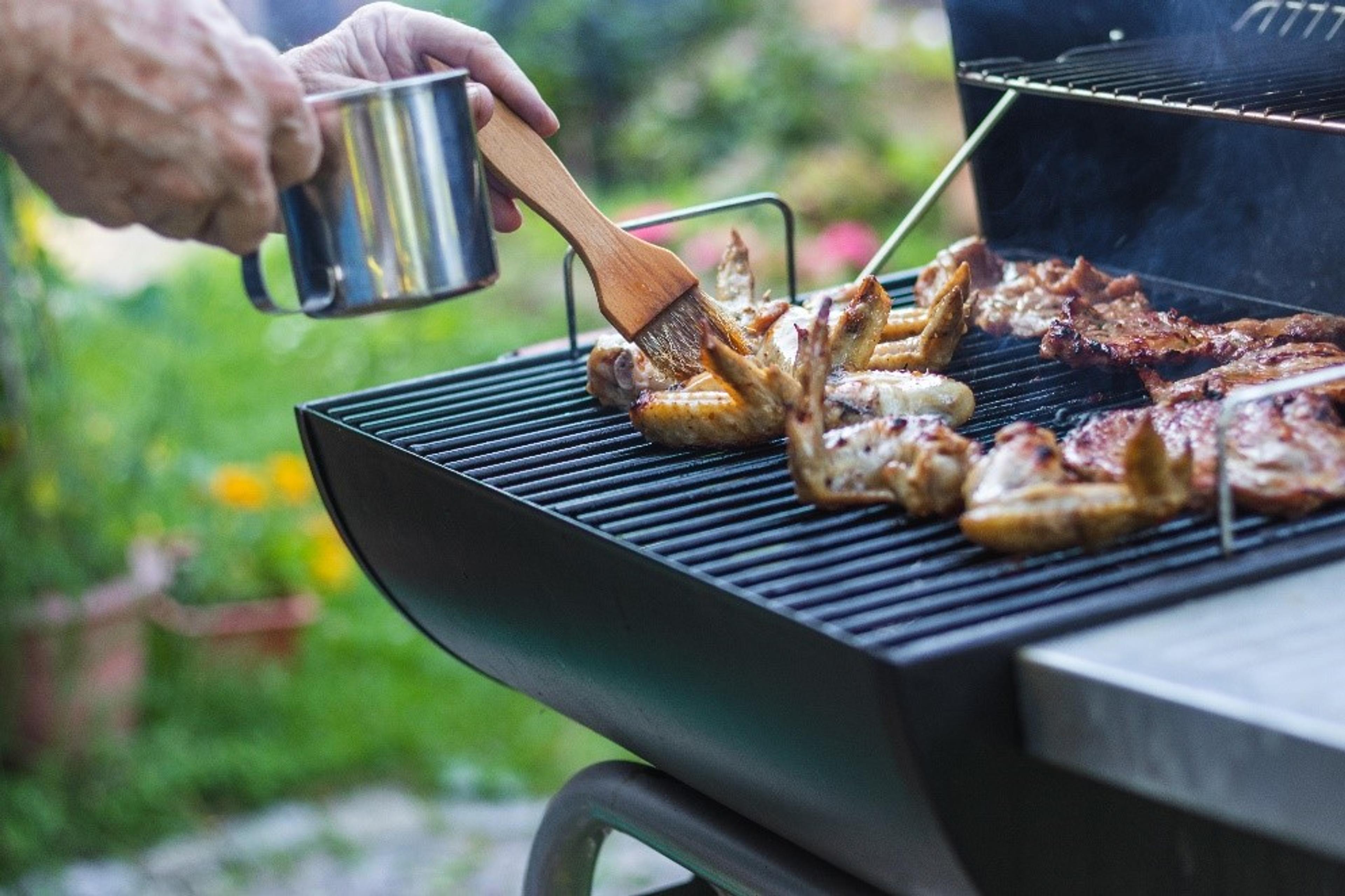 Person grilling meats